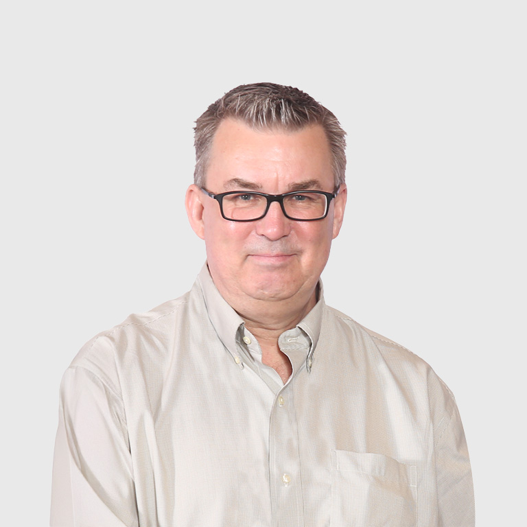 a man wearing glasses and a button up shirt