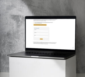 a laptop on a white box