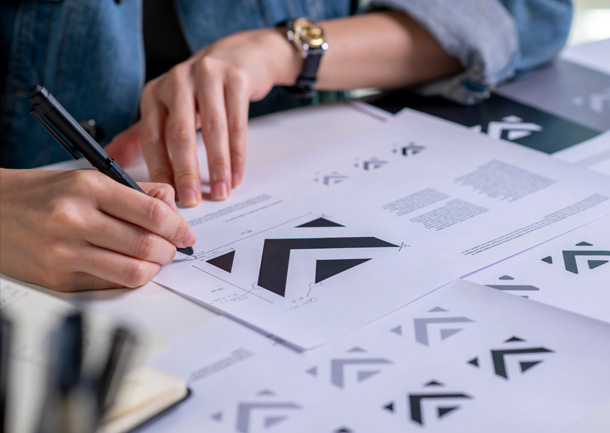 a person writing on a piece of paper
