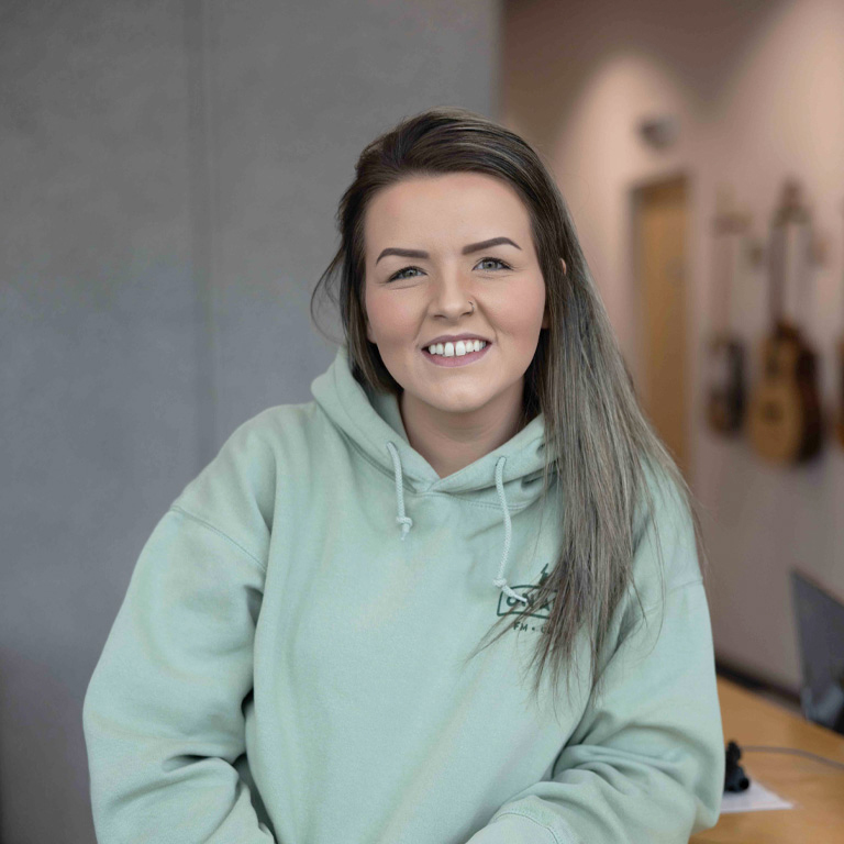 a woman smiling at camera