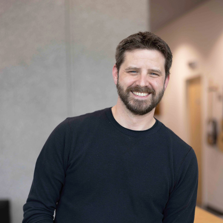 a man smiling at camera